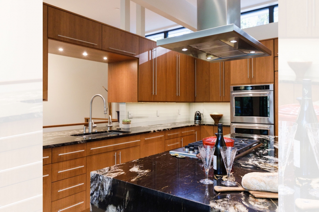 open-modern-kitchen-mahogany-cabinets-black-granite-1100x733.jpg
