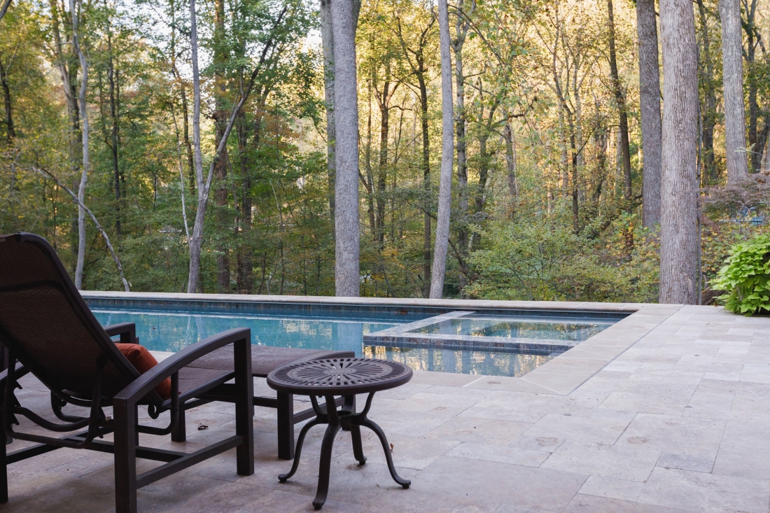 pool-with-wooded-view-stone-patio-1100x733.jpg