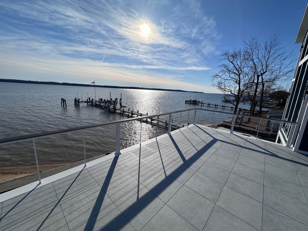 View of the Chesapeake Bay from elevated deck in newly completed modern, coastal home designed by 2e Architects